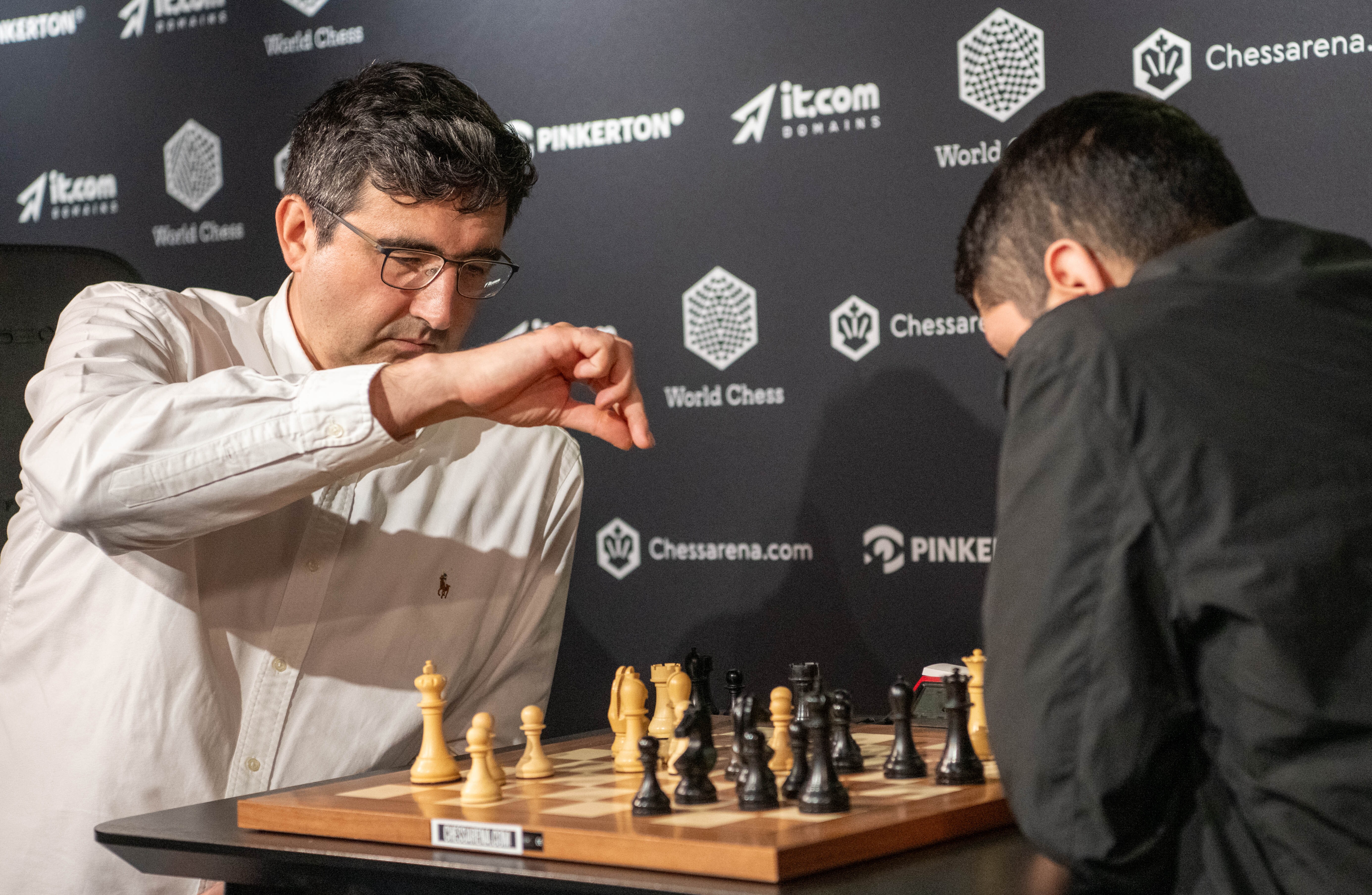 Chess Grandmasters Vladimir Kramnik (left) and José MartÃnez Alcántara face off at the World Chess Clash of Blames tournament on Aug. 19, 2024, in London. The International Chess Federation said Wednesday it is investigating Kramnik for allegations of cheating he levied at Daniel Naroditsky and other elite players.